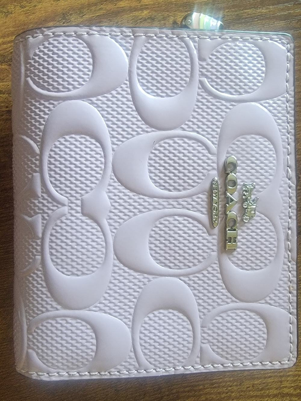 Coach Embossed Signature Patent Leather Bifold Wallet in Light Purple.